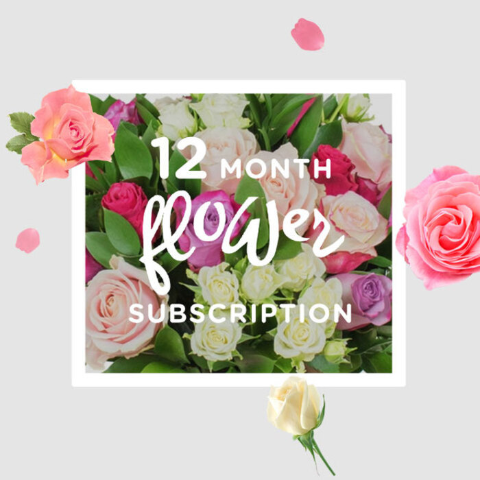 This image portrays a lush, hand-crafted rose arrangement intended to represent a full year of floral deliveries, much like a standing order from a trusted Golders Green florist. The bouquet is packed with roses in varied yet harmonious shades: pale blush that feels almost like first light over nearby Hampstead Garden Suburb, warm cream that suggests candlelit dinners, and deeper notes of magenta and raspberry adding romance and drama. Each rose head is distinct, some tightly furled with promise, others fully open and cupped, revealing intricate spirals of petals. These blooms are nestled into a supportive nest of glossy, deep green foliage, the leaves forming a gentle frame that keeps the colours vivid and grounded. Subtle lighting grazes the curve of each petal, highlighting their satiny, almost cool texture, as if you could reach out from a home off Finchley Road and feel the freshness that arrives with same-day delivery. Surrounding the central cluster, loose petals and occasional individual blossoms appear to float on a soft, neutral background, creating a halo of movement and suggesting the unfolding of each month in the subscription. The arrangement itself feels timeless and versatile, appropriate for birthdays, anniversaries, quiet thank-yous, or simply brightening long workdays. It captures an atmosphere of ongoing care: each new bouquet a chapter in a longer story, weaving gentle fragrance and soft colour into everyday life in Golders Green, from cosy flats above the high street to larger family homes near the park.