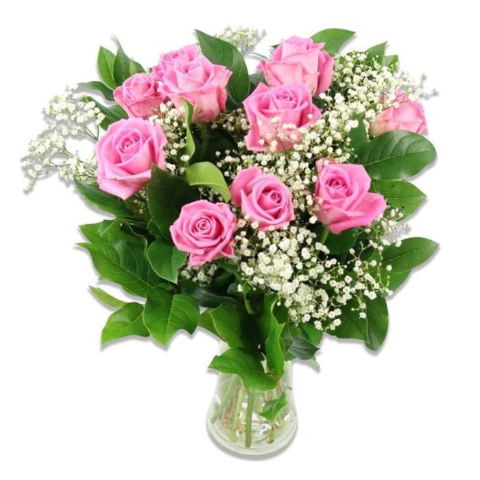 A beautifully balanced floral arrangement of pink roses and white baby's breath is showcased against a spotless white backdrop, allowing the colours and textures to take full focus. Approximately ten to twelve roses form the heart of the bouquet, their petals unfolding in graceful layers that move from a gentle shell-pink at the outer edges to a slightly deeper pink toward the center of a few blooms. Some flowers are fully open, revealing intricate whorls of velvety petals, while others remain in a more modest, half-open stage, suggesting freshness and the promise of continued blooming. Threaded throughout the roses are generous tufts of baby's breath, each tiny white blossom clustered along slender stems, creating a soft, cloud-like veil that brings a sense of airiness and innocence. Encasing the arrangement, lush dark green foliage fans out around the blooms, the leaves smooth and slightly glossy, framing the pastel palette with a rich, organic contrast. The bouquet is gathered into a straightforward clear glass vase, where the stems are visible beneath the waterline, reinforcing the idea of a freshly prepared, carefully conditioned display one might expect from an experienced local florist serving families in Golders Green and nearby Cricklewood. The lighting is bright and even, with no distractions, so the viewer's attention rests entirely on the interplay of pink, white, and green. This classic yet tender design feels particularly suited to baby celebrations-a delicate welcome for a new arrival, a thoughtful hospital delivery gift, or a charming arrangement staged in a nursery. The image supports content about new baby flowers, soft pastel bouquets, and the timeless appeal of roses for marking life's earliest milestones around Golders Green.