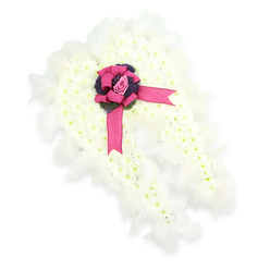 An angelic funeral flower tribute is shaped into a pair of outstretched wings, displayed on a crisp white background so that every detail of the design stands out clearly. The wings themselves are built from a dense carpet of small white chrysanthemums or similar blossoms, each head nestled tightly beside the next to create a soft, cloud-like surface, with tiny hints of fresh green in their centres. Their gently curving outline is edged with a fringe of airy white feathers, giving the impression of weightless plumage and lending the arrangement a celestial, almost floating quality. Where the two wings meet at the centre, the tone shifts from pure white to vivid colour: a deep fuchsia satin ribbon is fashioned into a generous bow, its lustrous loops and trailing ends lying gracefully over the flowers. Nestled in the heart of the bow is a single pink rosebud, its petals still partly closed, radiating quiet affection and the intimacy of a personal goodbye. Around the rose, small sprays of dark purple, thistle-like flowers introduce both texture and shadow, making the rose and ribbon appear even more luminous. The tribute feels contemplative and reassuring, like a blessing offered in petals and feathers. It is the kind of bespoke sympathy piece that might be chosen for a service in Golders Green, perhaps after a reflective walk through the quiet paths of Golders Hill Park, created by a local florist attuned to the needs of families searching for a meaningful, angel-themed memorial to honour a much-loved life.