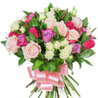 A lush, hand-tied bouquet of mixed roses sits against a clean white background, its shape rounded and generously filled. The dominant blooms are large, classic roses in soft pastel pink and creamy white, some petals fully unfurled to reveal layered, velvety textures while others remain in elegant bud form. Punctuating the arrangement are vivid deep fuchsia roses and a few delicate lavender blossoms that catch the eye and add a cool, romantic contrast. Nestled throughout are clusters of small spray roses-mostly creamy white with whispers of pale yellow-that give the composition intimacy and gentle movement. Dark green, glossy foliage, likely ruscus or salal, is woven between the flowers; the spear-shaped leaves provide a fresh, verdant frame that makes the petals read brighter and more lively. At the base the stems are neatly gathered and wrapped, secured with a wide baby-pink satin ribbon tied into a large, soft bow whose sheen reflects a little light. The bouquet suggests a faint, classic rose scent-softly rosy with a green, dewy undernote-as if arranged in the cool morning light of Golders Green near Golders Hill Park. The white backdrop keeps attention on the textures, colours, and craftsmanship: the dense layering of petals, the glossy leaf surfaces, and the gentle swelling of buds. This arrangement feels celebratory and tender at once, ideal for Mother's Day, anniversaries, birthdays, or a heartfelt thank-you for someone in Golders Green, Finchley Road or nearby Hampstead - a gift that reads as intimate, joyful, and thoughtfully made.