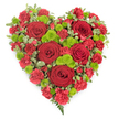 A vibrant heart-shaped floral display filled with red and green blooms appears against a plain white backdrop, its colours clear and its message unmistakably tender. The arrangement is completely heart-shaped, with a full, rounded top and a defined point at the base, created entirely through the careful placement of flowers rather than any visible frame. Across the heart, several sumptuous deep red roses sit proudly, each one crafted by nature into a swirl of velvety petals that gently unfold, creating pockets of shadow and highlight where the light touches them. Around and beneath these roses, a carpet of red carnations and mini carnations forms, their multi-layered, frilled petals creating a soft, plush surface that feels comforting and abundant. Threaded carefully through the red are bright lime-green button chrysanthemums, each small bloom a perfect dome of tight florets, adding a lively spark of colour and visual rhythm. Along the outer edge, neat sprigs of variegated green-and-cream foliage mark out the shape, and a few slender fern fronds slip gracefully from the bottom tip, giving the design a gentle, natural finish. The lighting is bright yet soft, highlighting the freshness of the petals and the healthy sheen of the foliage. This type of floral heart would be a thoughtful choice for a funeral at a local Golders Green chapel or a remembrance gathering near Golders Hill Park, conveying love, gratitude, and sympathy in a single, eloquent arrangement that feels both classic and contemporary.
